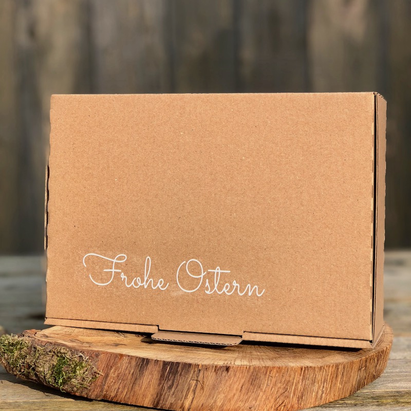 Ostern Geschenkset kaufen Ostern Geschenkset Box mit der Aufschrift Frohe Ostern und unterschiedlichen Chiliprodukten als Inhalt