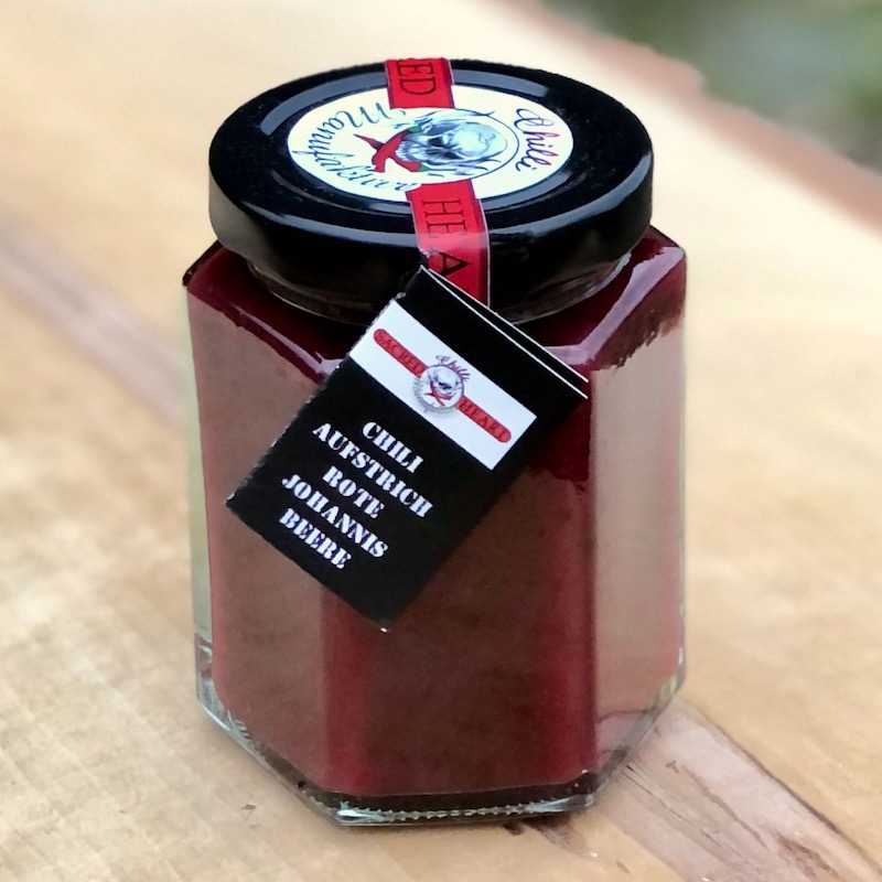 Fruchtaufstrich rote Johannisbeere mit leichter Chilischärfe kaufen Fruchtaufstrich rote Johannisbeere mit leichter Chilischärfe im Glas von der Chilli Manufaktur kaufen