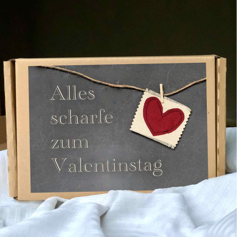 Das Bild zeigt eine Box als Valentinstag Geschenk für den Mann mit der Beschriftung Alles scharfe zum Valentinstag